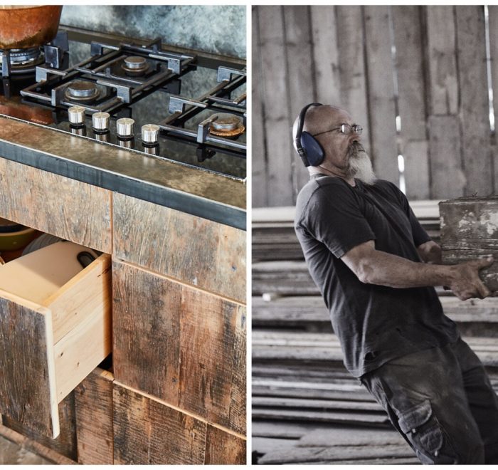 Reclaimed engineered drawer stack next to worker pulling raw oak beam through bandsaw