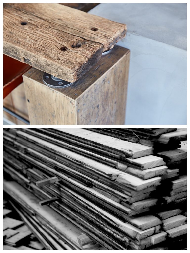 Raw rustic wood breakfast bar next to pile of unprocessed wood timber