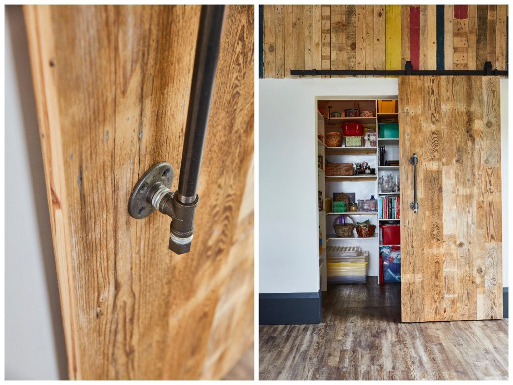 Reclaimed sliding barn door leads to pantry