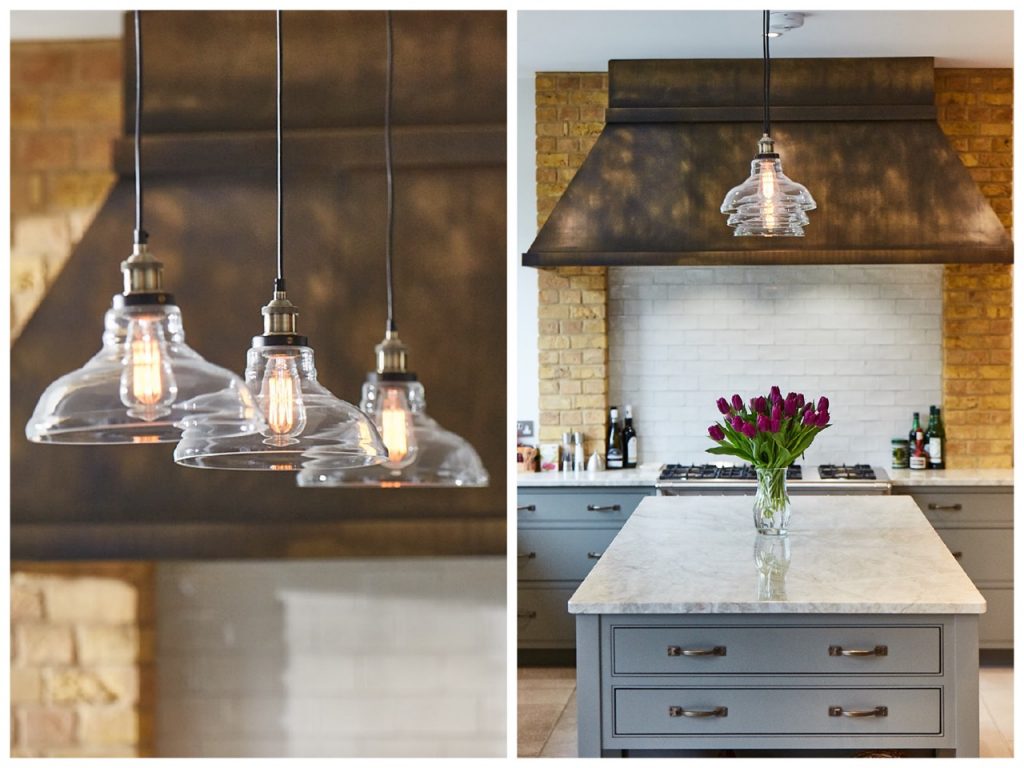 Glass pendant lights above bespoke kitchen island