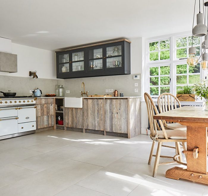 White driftwood bespoke kitchen with white Lacanche range cooker and painted lamp black wall cabinets