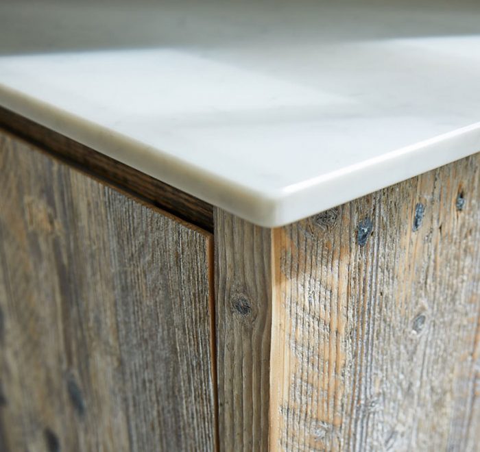 White quartz kitchen worktop on top of reclaimed rustic wood unit