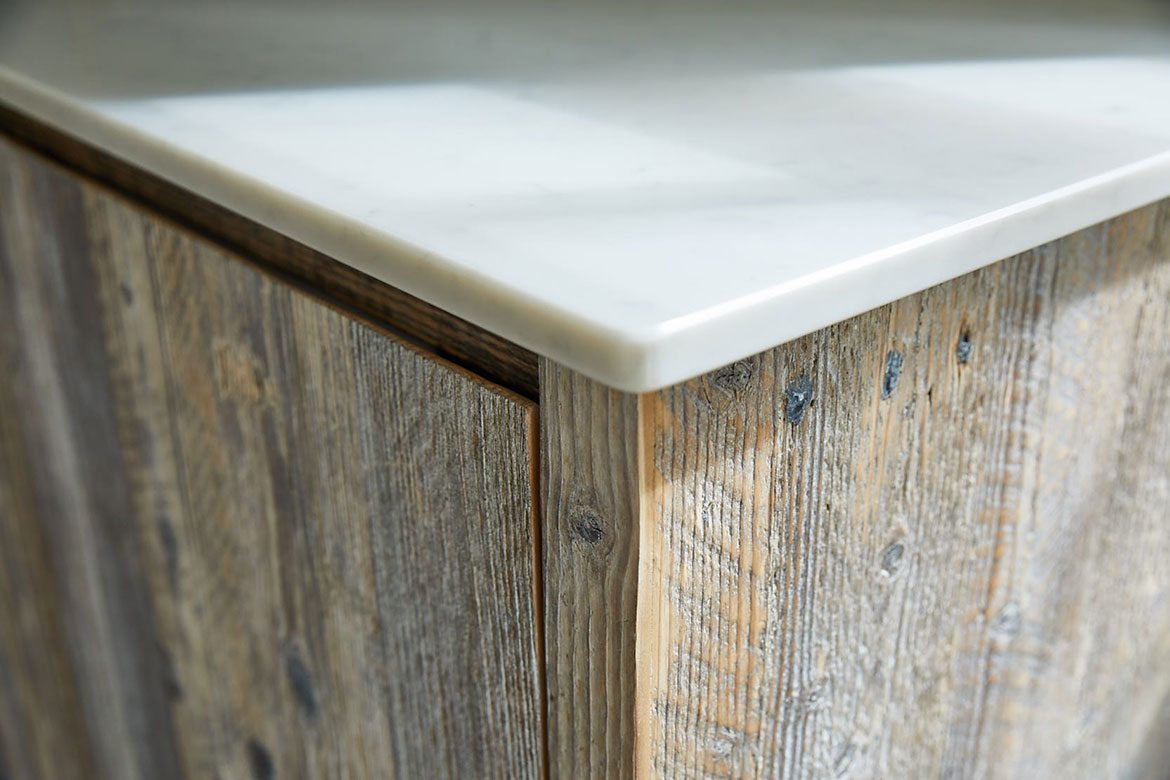 White quartz kitchen worktop on top of reclaimed rustic wood unit