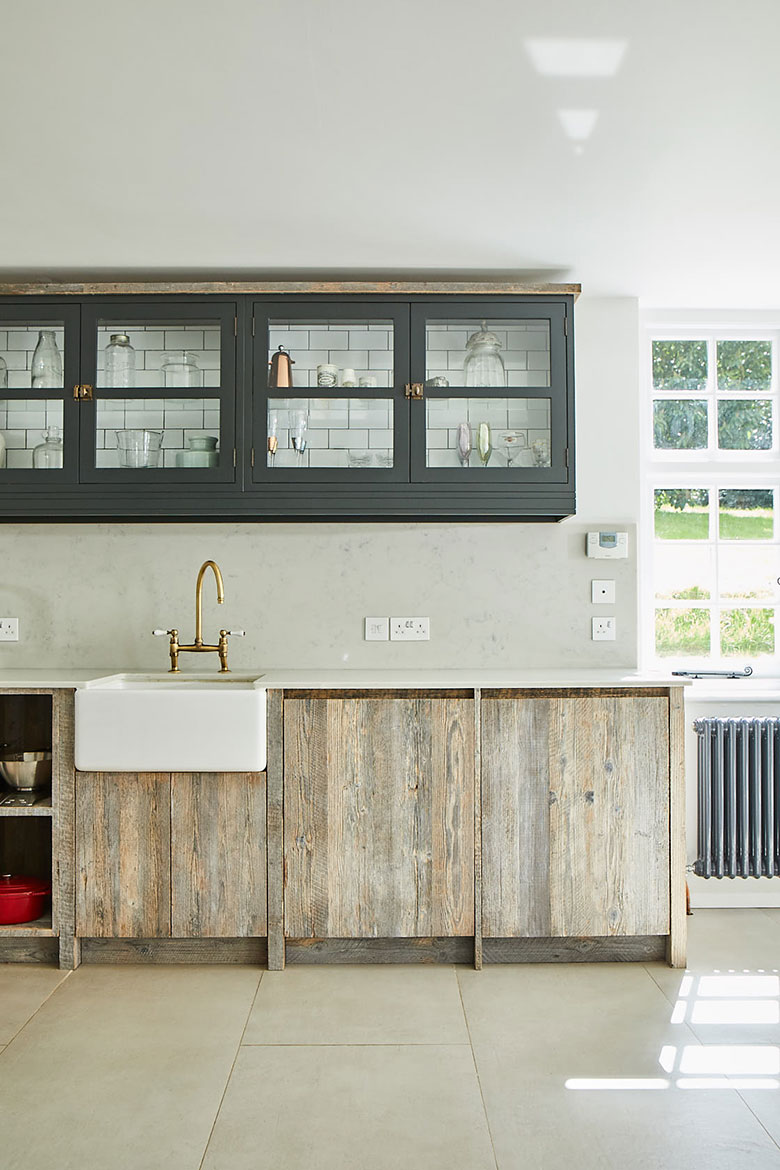 Reclaimed kitchen sink run with ceramic Belfast sink and painted wall cabinets above