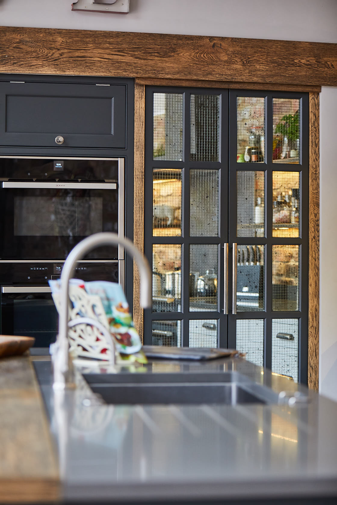 Vintage wire painted cabinet doors to secret walk in pantry larder