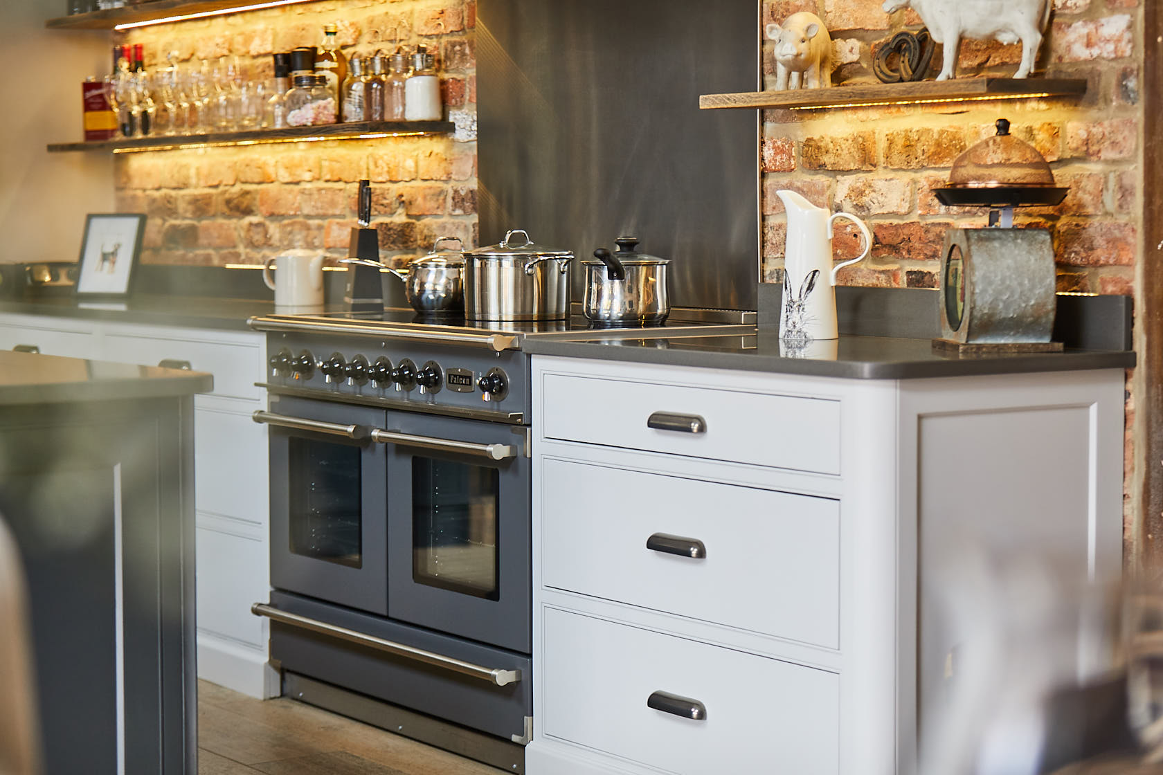 Pan drawers with Finesse pewter cup handles and Caesarstone worktop