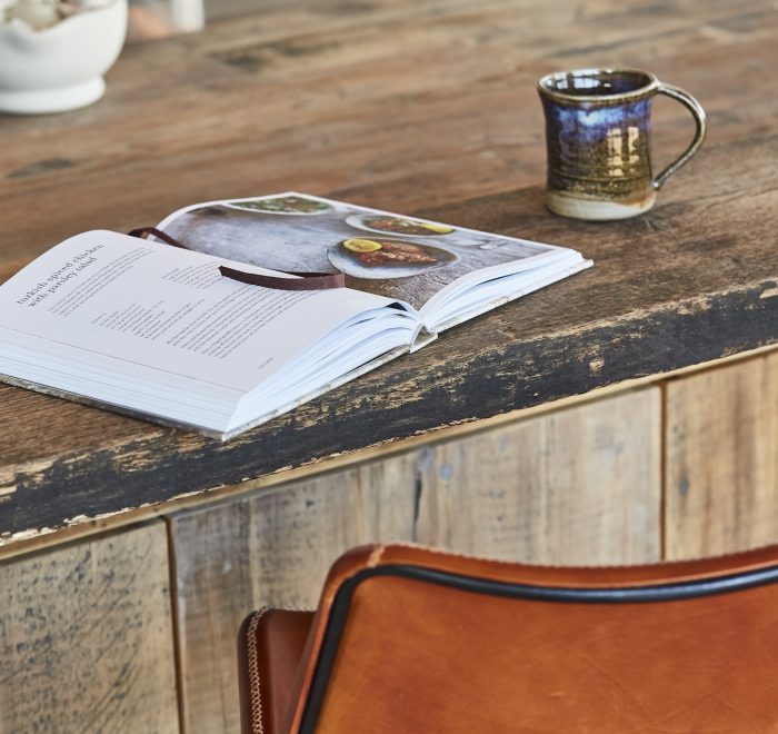 Rustic reclaimed breakfast bar with open book and mug