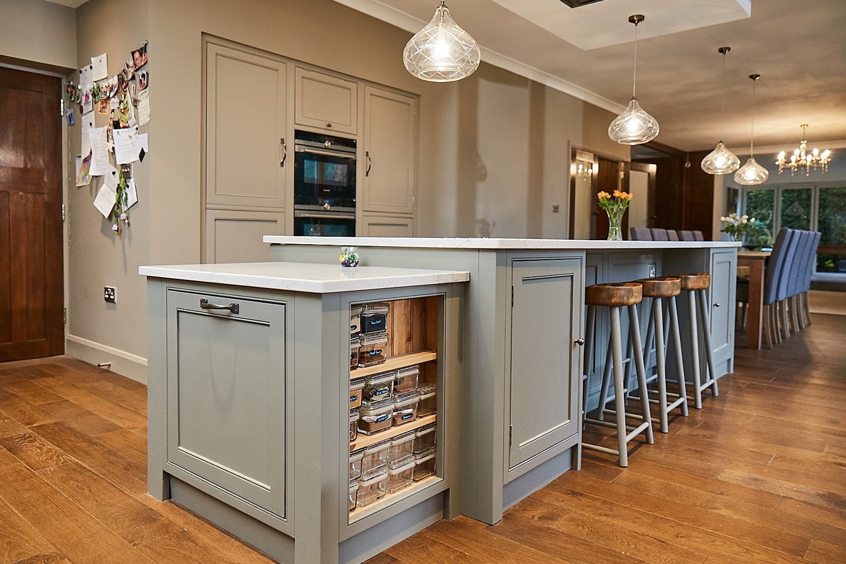 Bespoke kitchen unit with open spice rack on the side