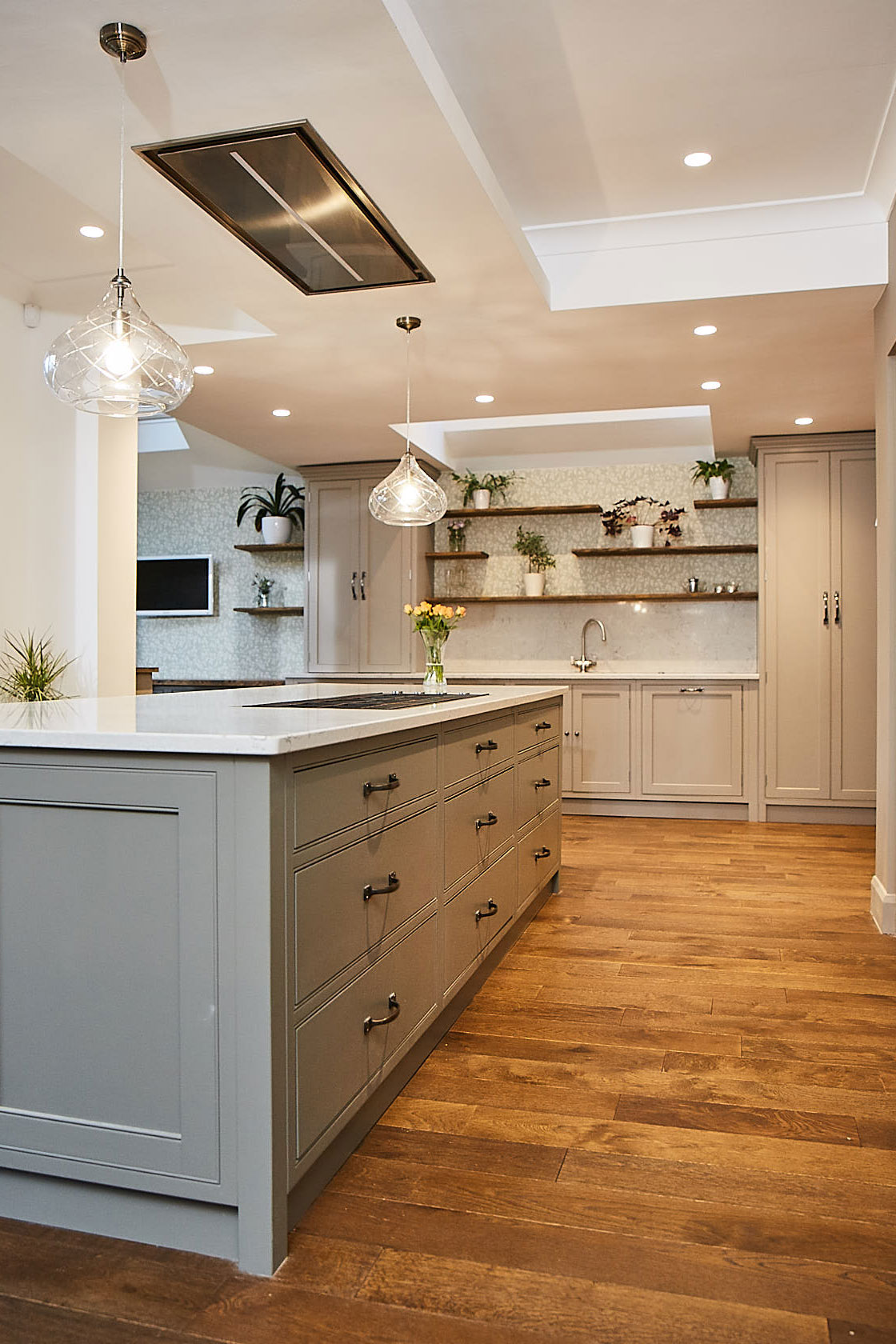 Traditional painted kitchen island with oak floor boards