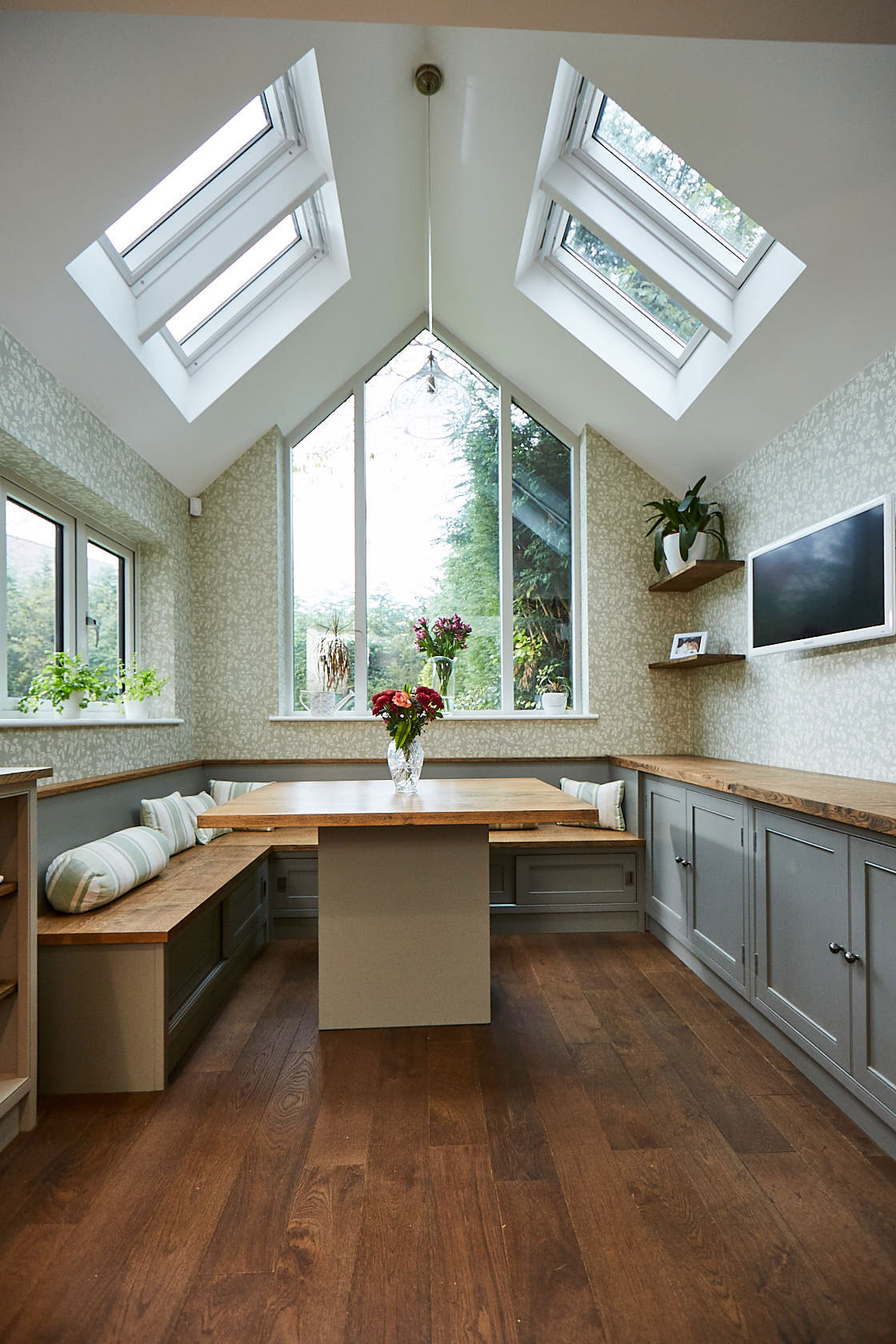 Bespoke kitchen table with fitted booth seating around