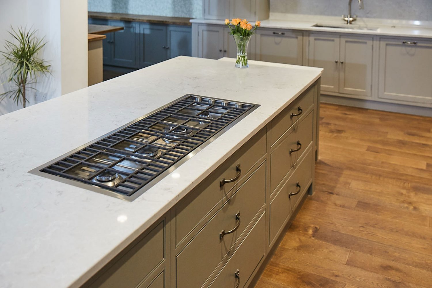 Flush gas hob on kitchen island with hand ages oak floor