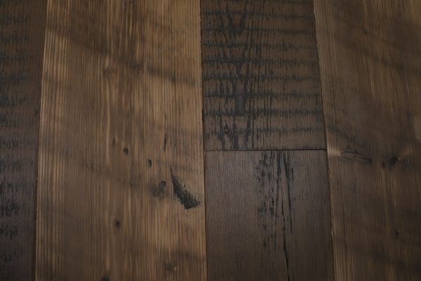 Knot on reclaimed pine floor board