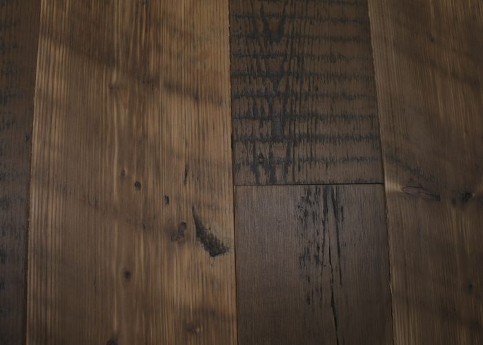 Knot on reclaimed pine floor board