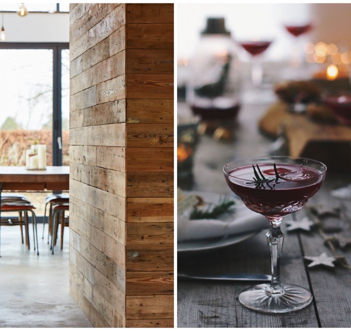 Cocktail in glass next to reclaimed cladded wall