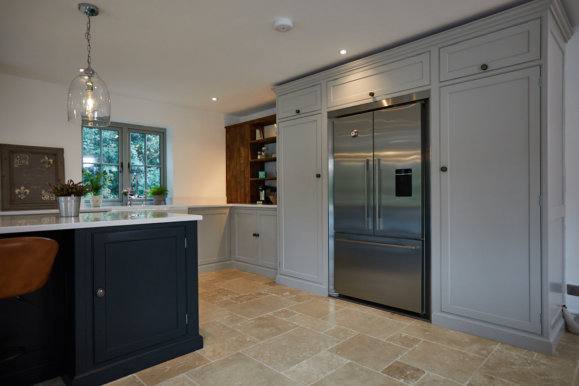 Fisher & Paykel fridge freezer integrated in to tall painted kitchen cabinets