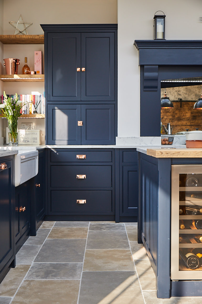 Dark blue pan drawers with copper cup handles