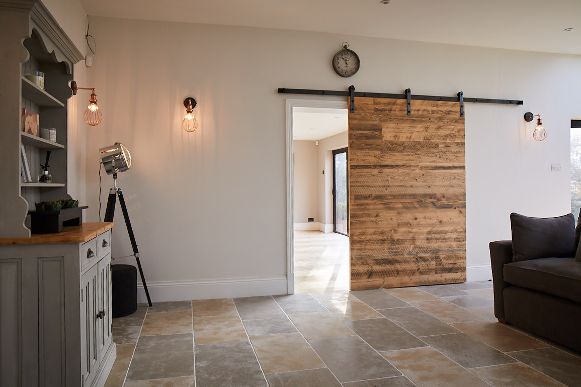 Engineered reclaimed pine door with industrial sliding mechanism