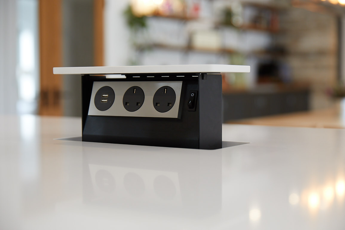 Pop up plug in kitchen island with white quartz worktop