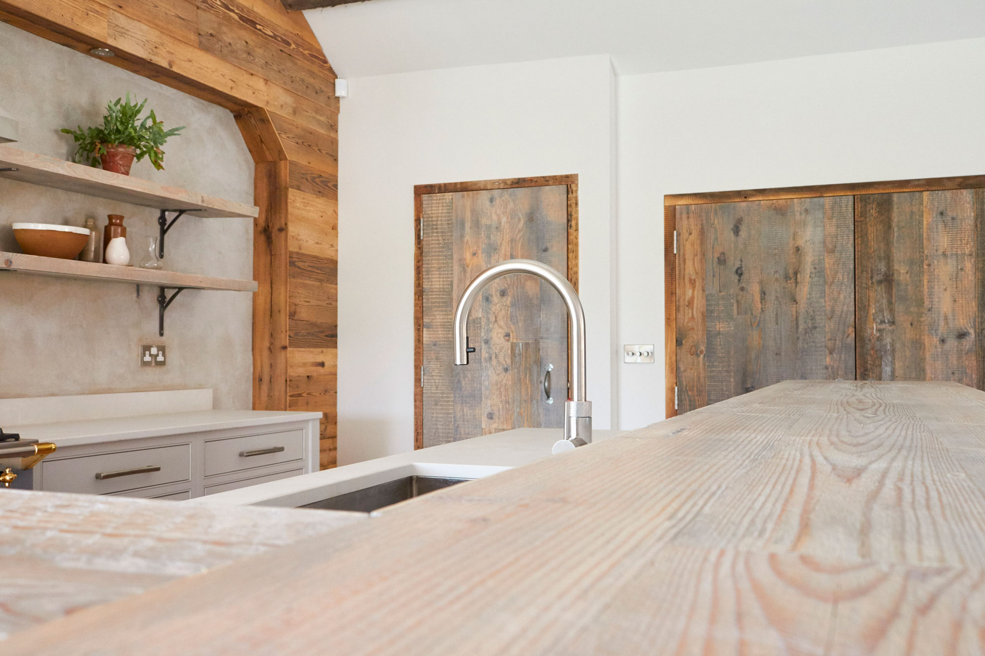 Engineered whitewash pine worktop with stainless steel kitchen tap