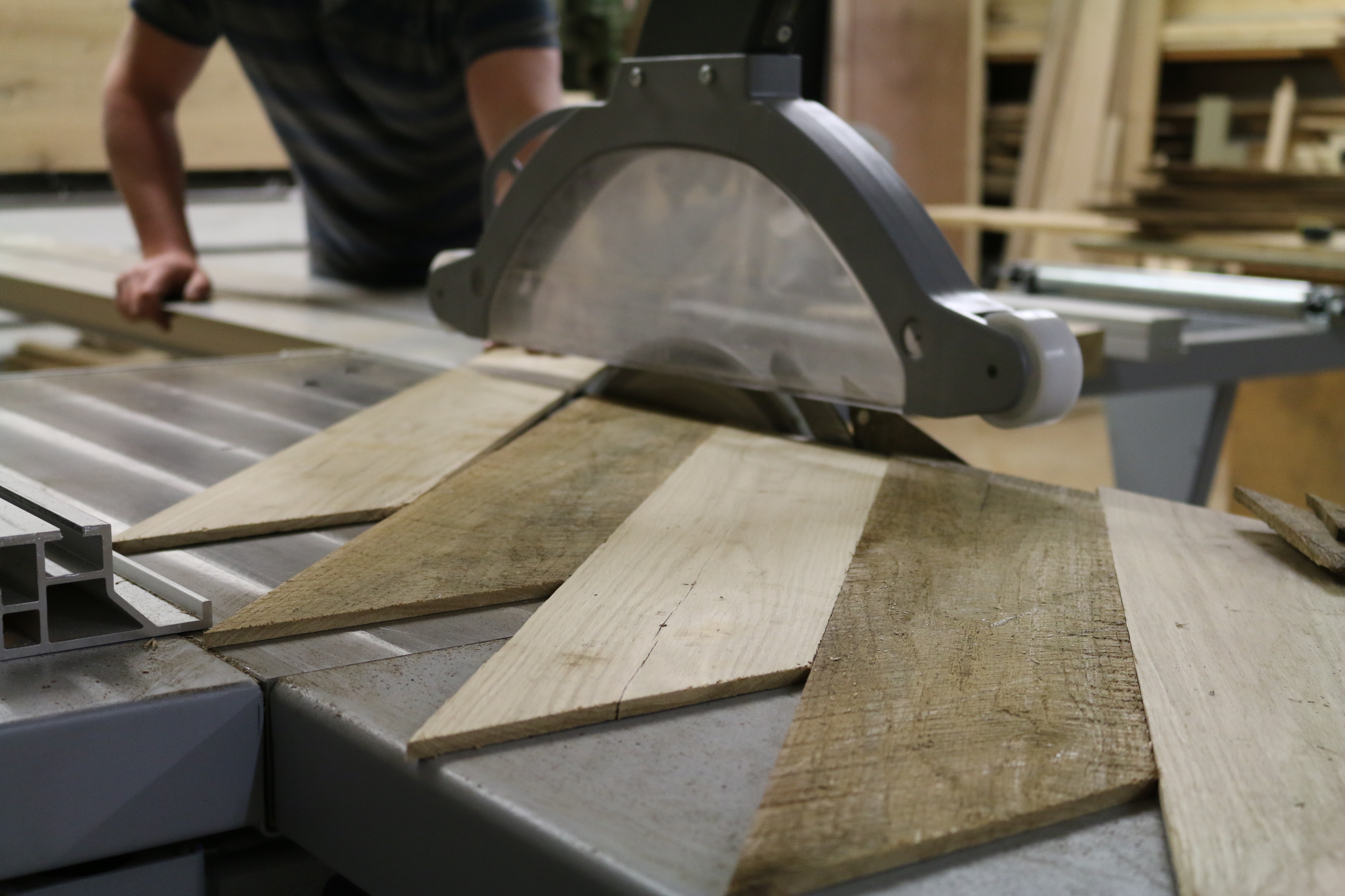 Worker on cross cut saw