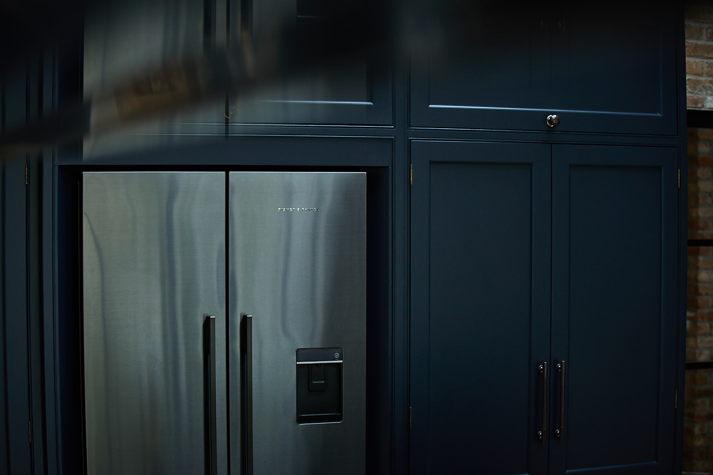 Gun metal Fisher & Paykel stainless steel fridge freezer integrated in to tall painted cabinets