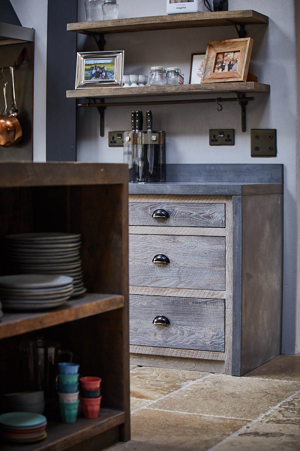 Engineered oak pan drawers with solid concrete worktop and aged antique cup handles