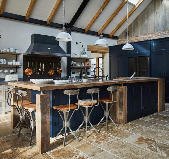 Reclaimed oak breakfast bar with dark blue Little Greene kitchen units