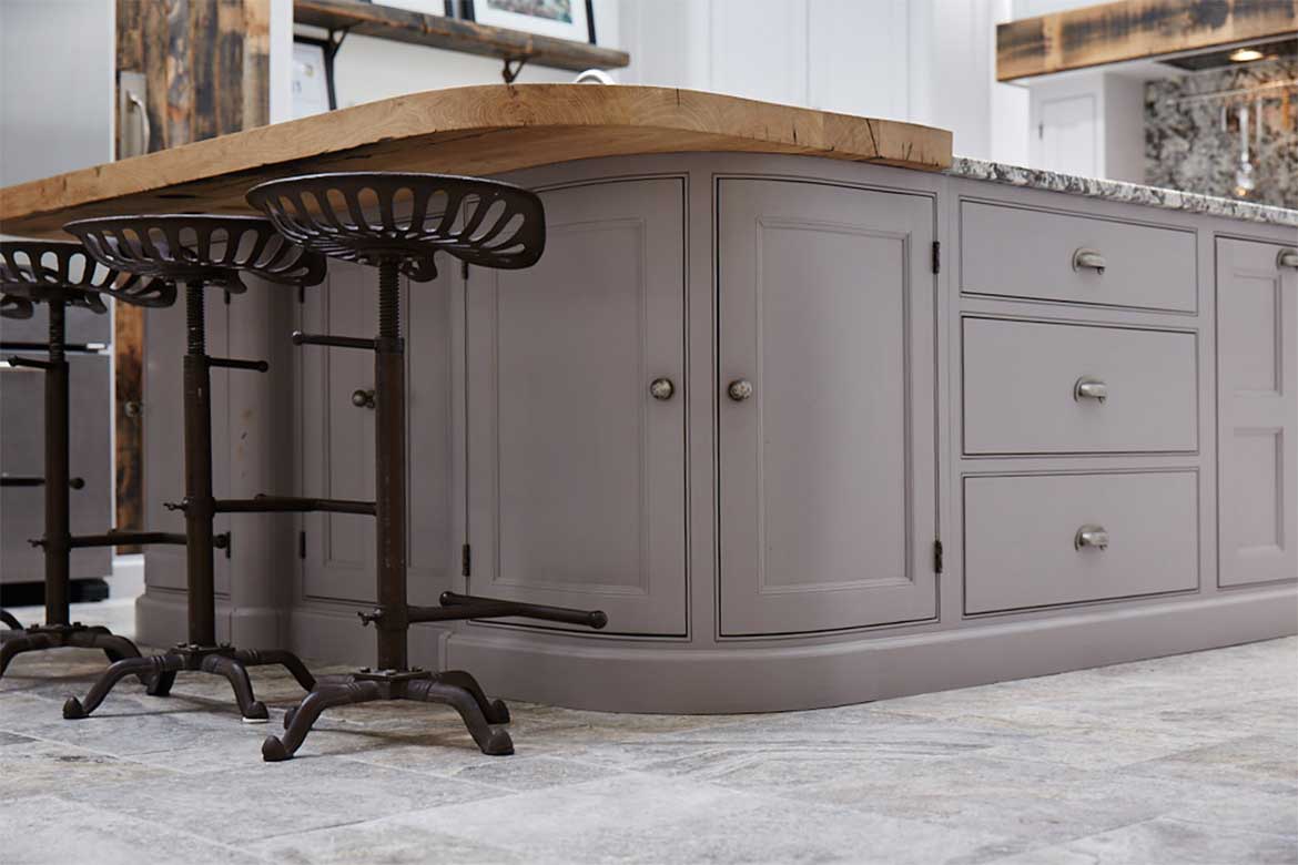Bespoke kitchen island by The Main Company painted in Little Greene paint with a reclaimed oak breakfast bar and cast iron bar stools