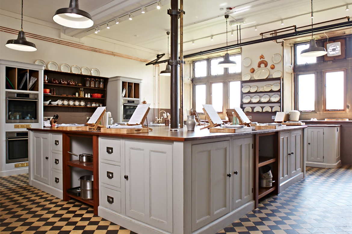 Cookery school with bespoke island made from reclaimed teak and painted kitchen units