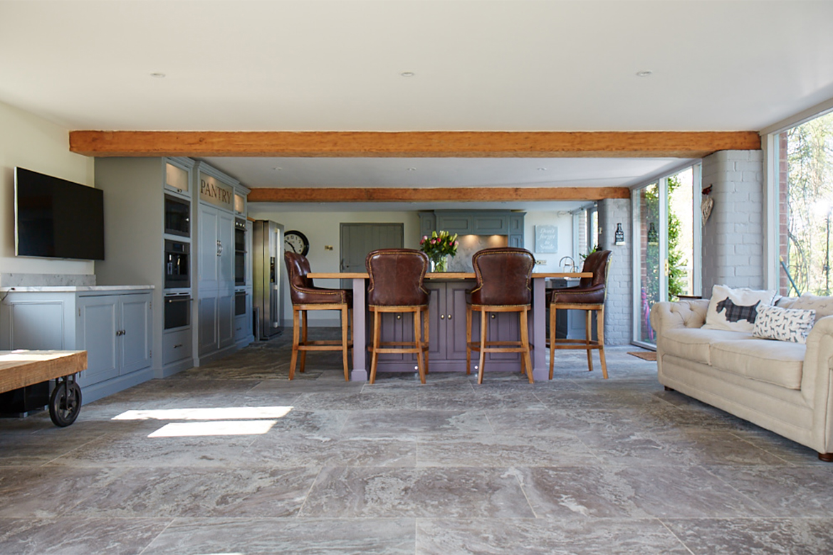 Bespoke kitchen island with 4 grosvenor leather bar stools under solid oak worktop