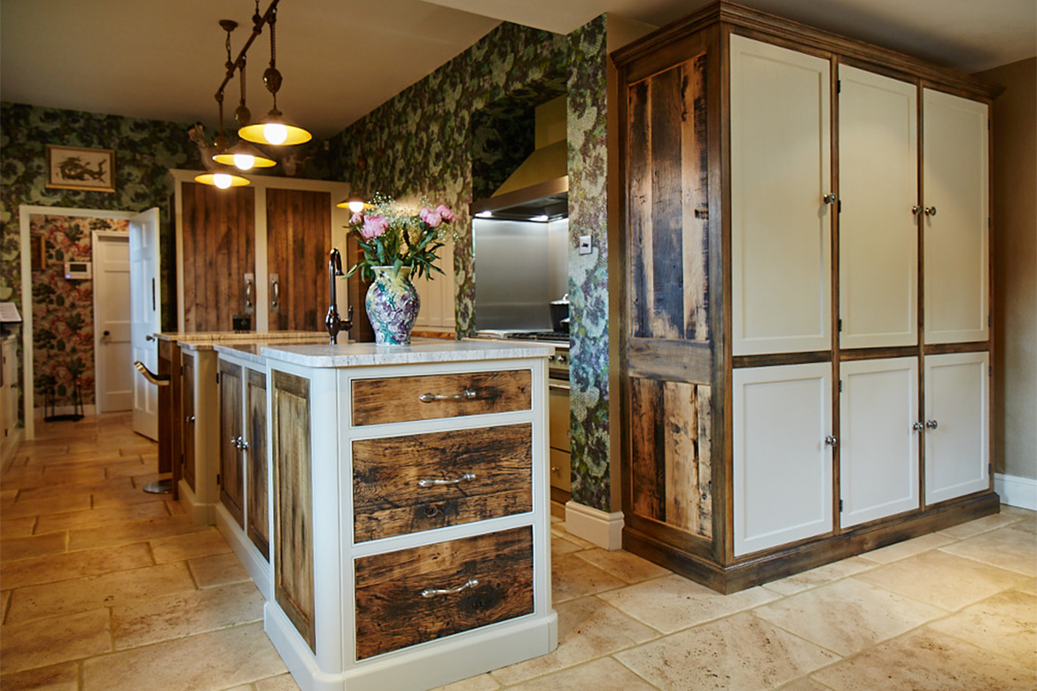 Rustic reclaimed oak drawer fronts with painted grey little green frames on this bespoke kitchen island