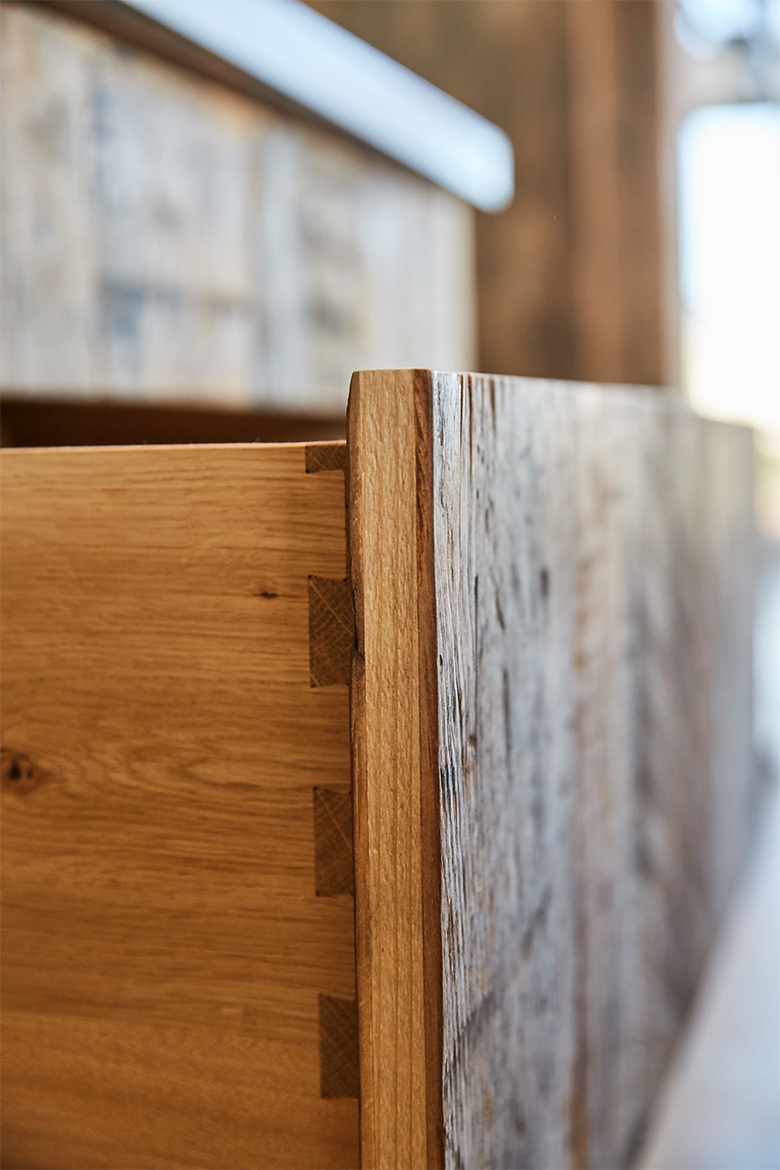 Bespoke dovetails on solid oak drawer boxes with reclaimed engineered pine fronts