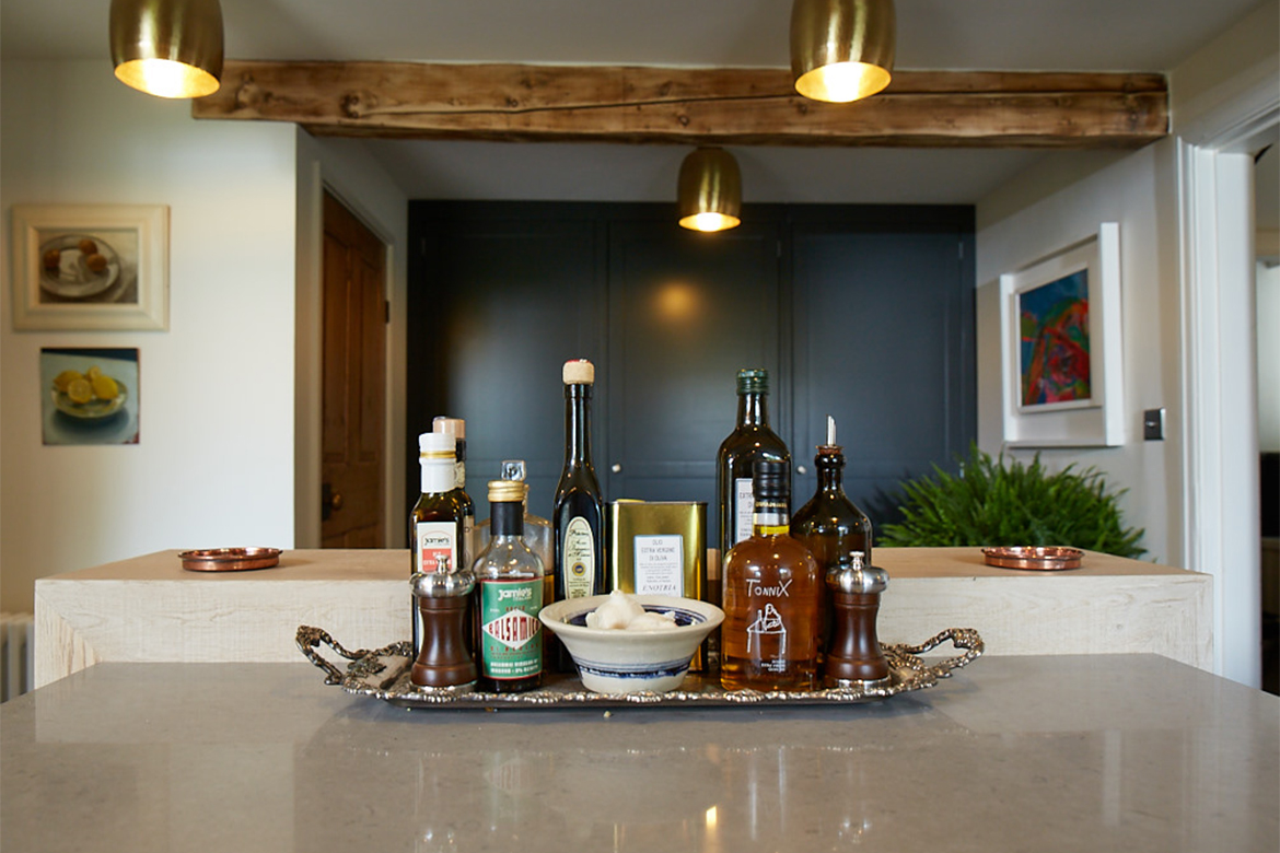 Condiments on a tray sat on caesarstone worktop