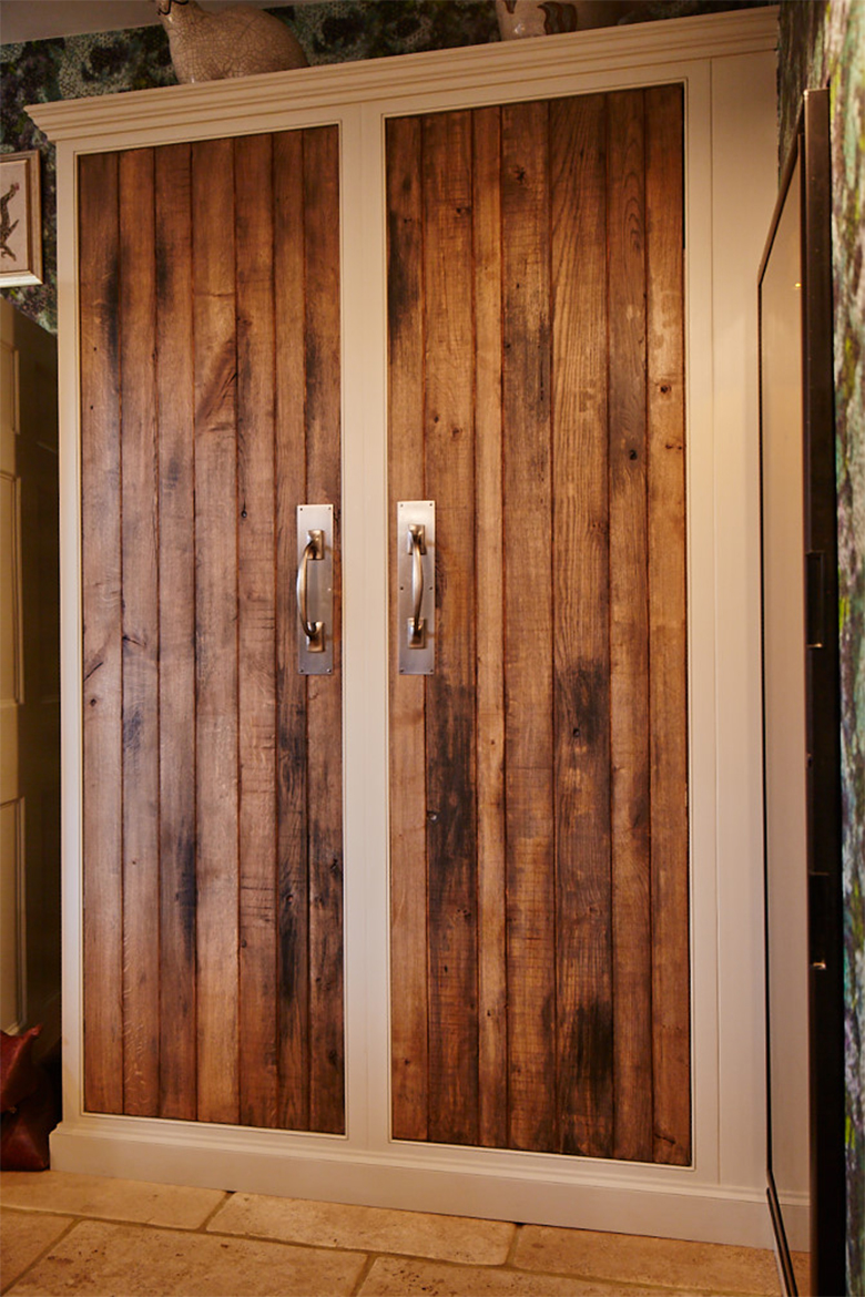 Two tall bespoke larder doors with tongue and groove solid reclaimed rustic oak detail