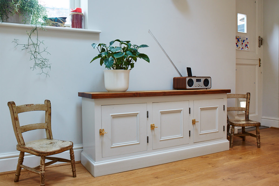 Bespoke painted locker cupboard dressed with vintage chairs, retro radio and plant