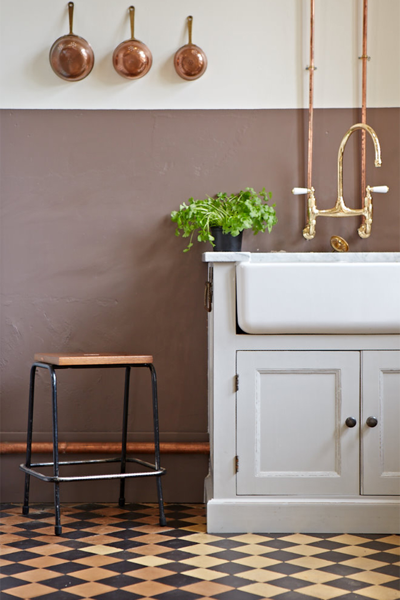 Shaws double belfast sink with gold taps and exposed copper pipes