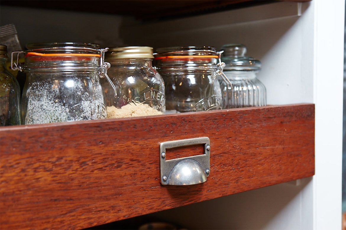 Reclaimed teak drawer boxes with vintage pewter cup handle holding kilner jars