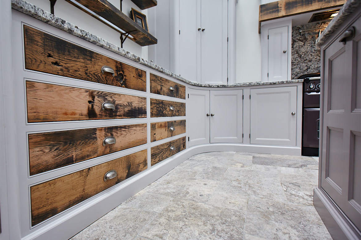 Close up of reclaimed oak drawer fronts with pewter cup handles