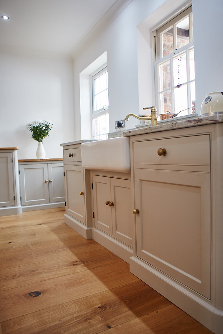 Bespoke kitchen sink run with shaws belfast sink and brass tap and matching burnt brass knobs