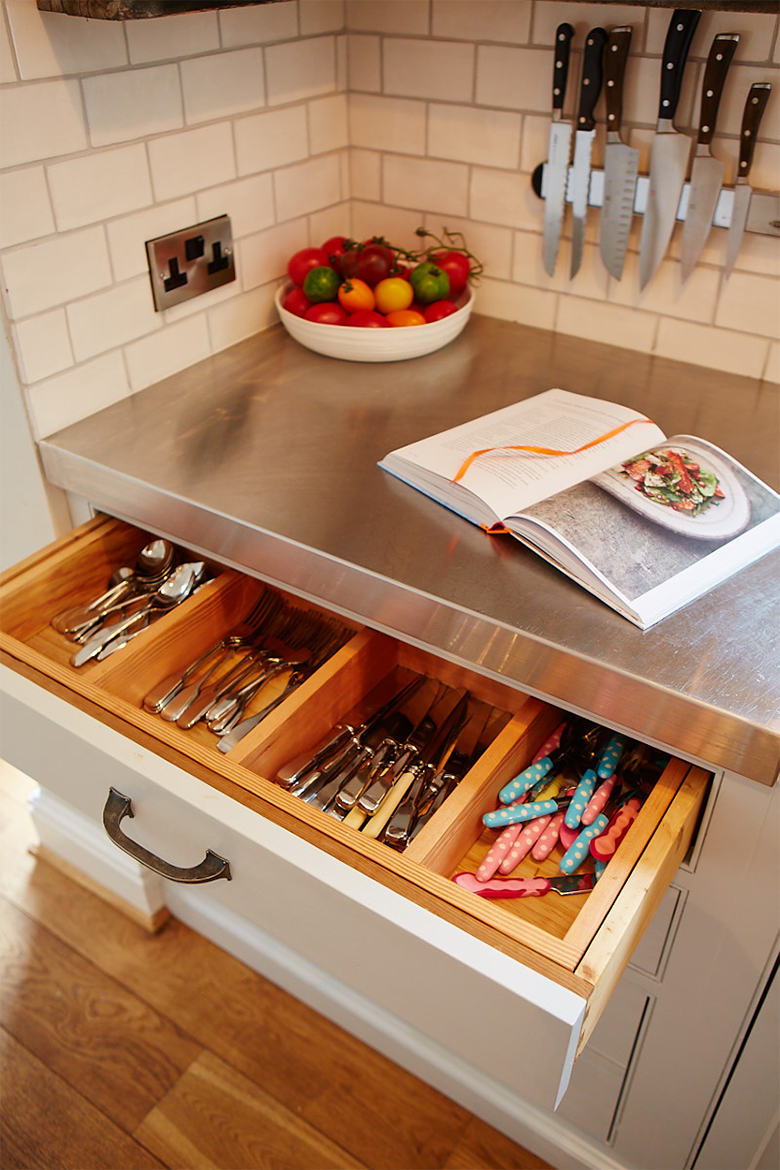 Bespoke kitchen utensil and cutlery divider inside painted cabinet