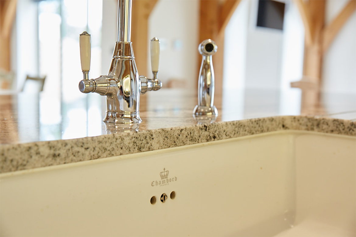 Chambord sink branding with granite worktops and chrome taps