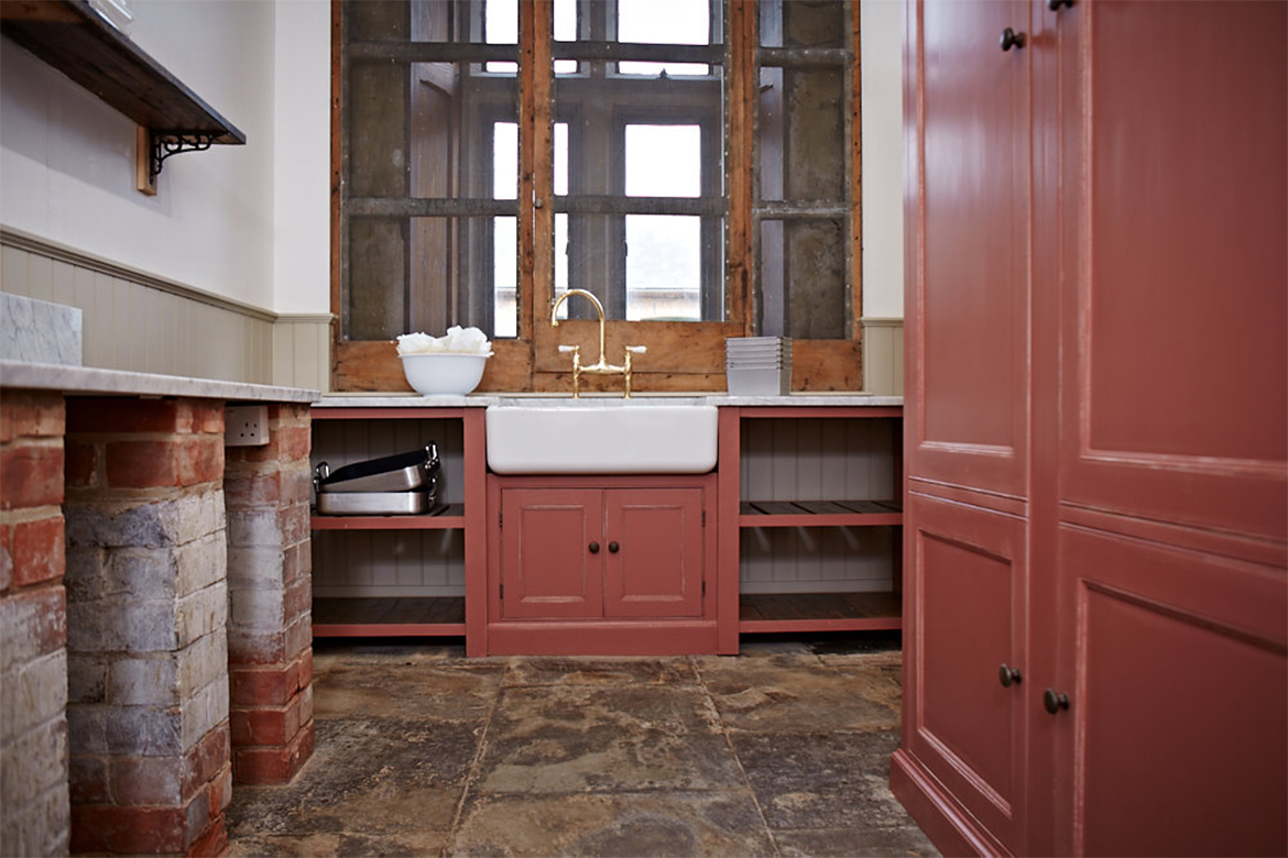 Utility with red pot boards and original stone flagged floor