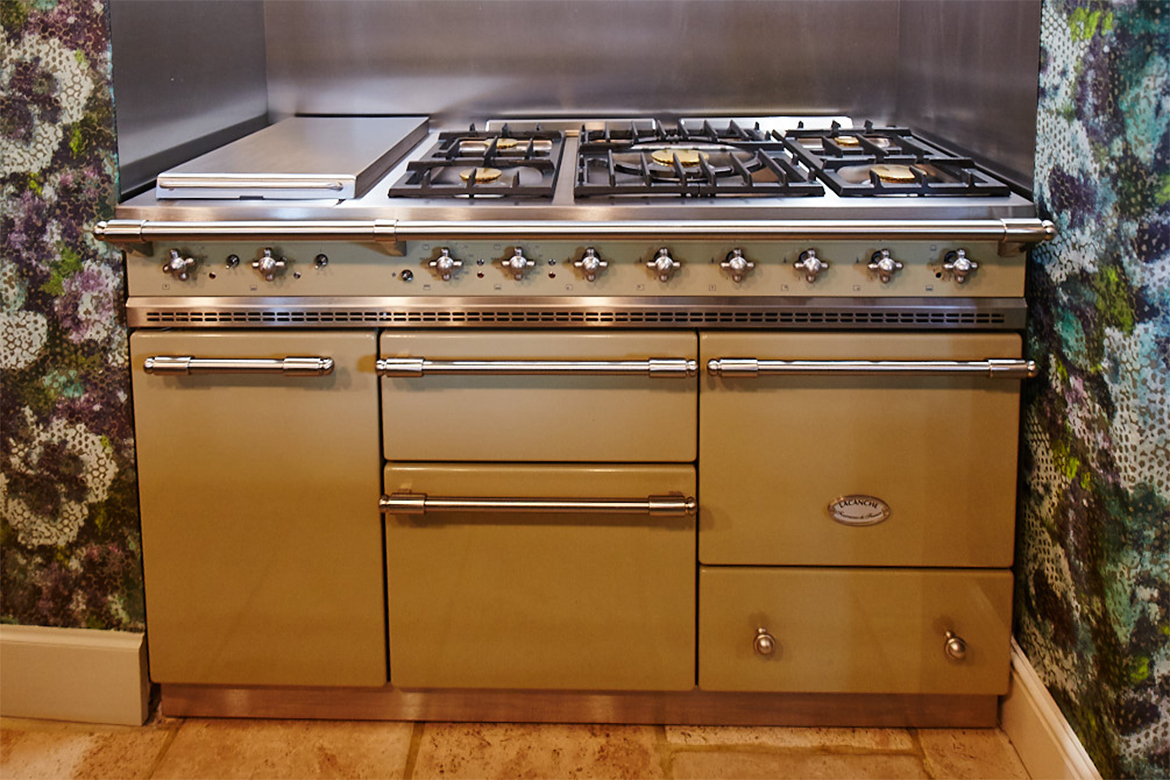 Elevation of green Chaussin Lachance range cooker with brass detail