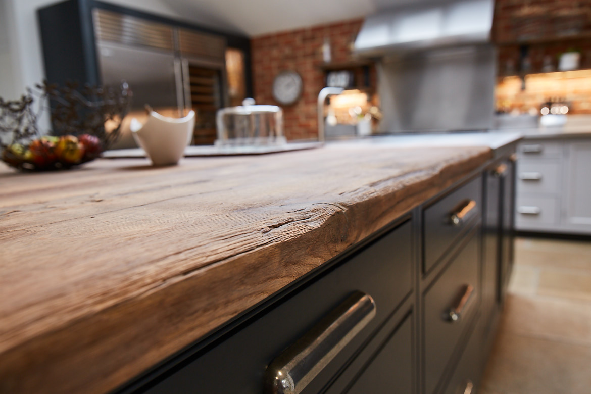 Close up of the a reclaimed oak worktop on the bespoke kitchen island