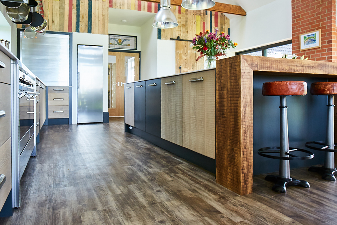 Bespoke kitchen island with wrap around reclaimed wood breakfast bar