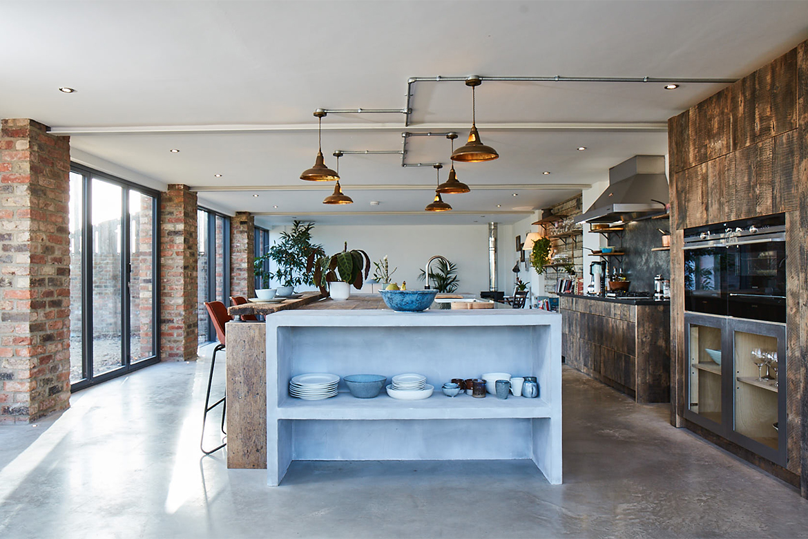 Bespoke light grey concrete island end filled with porcelain