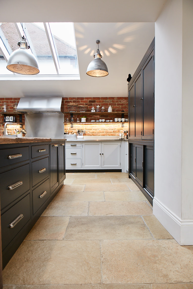 Front on view of the range run with brick wall and limestone tiles