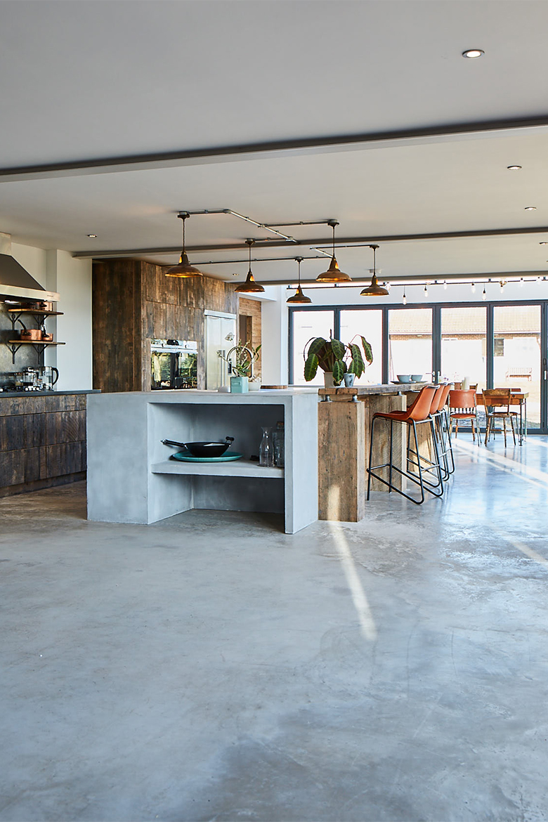 Bespoke kitchen concrete floor with concrete island end and reclaimed oak wood breakfast bar