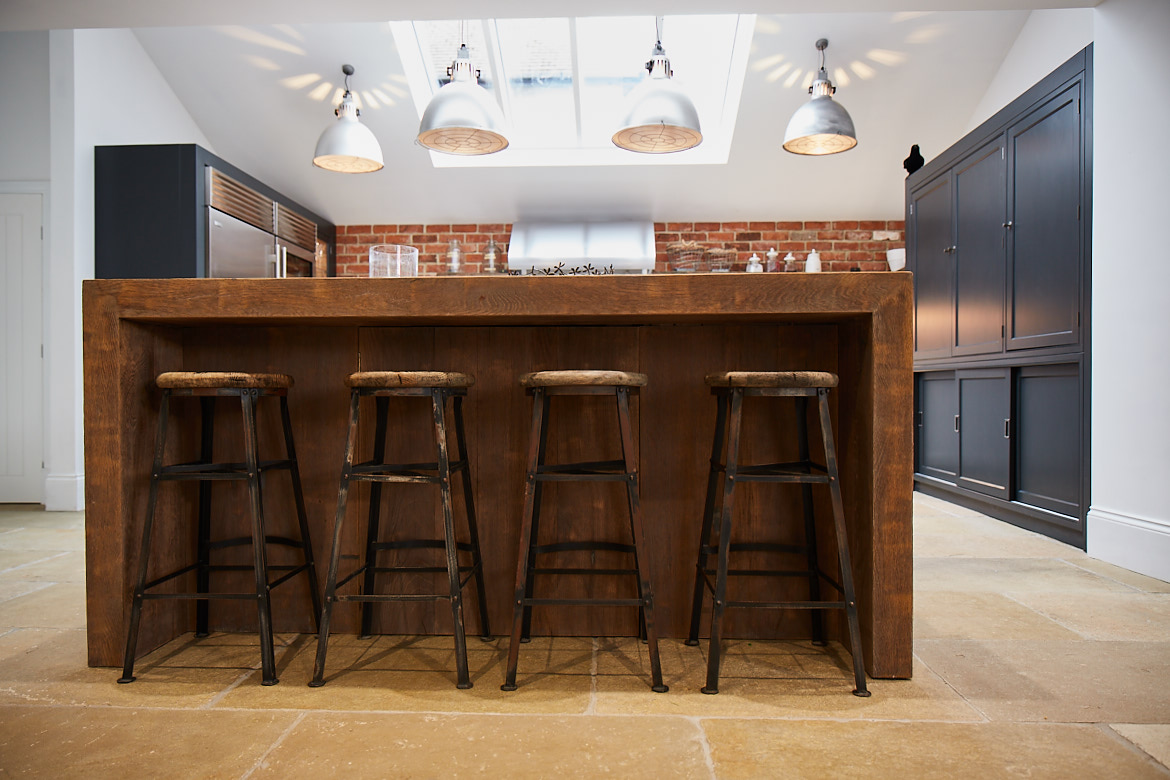 4 industrial reclaimed oak and metal barstools under breakfast bar