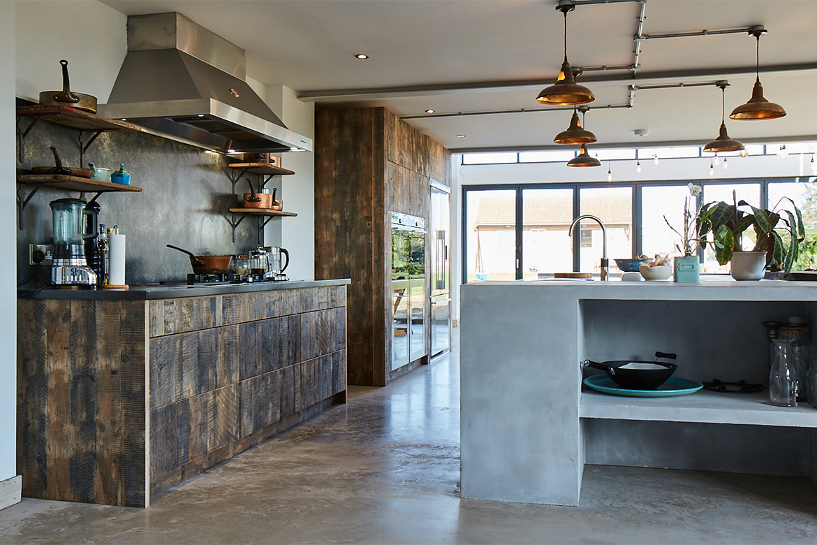 Reclaimed oak kitchen drawer units with zinc patina worktop and Lacanche extraction above